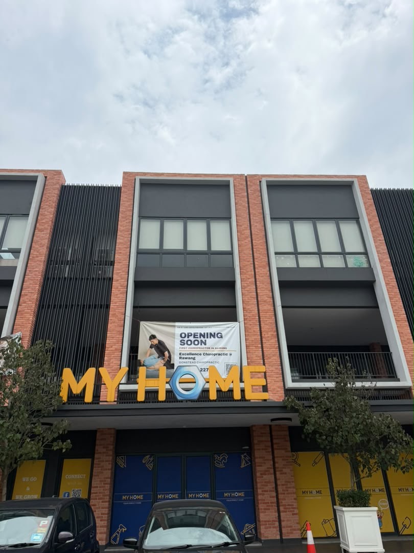 The MY HOME shopfront at Gamuda Square with the Excellence Chiropractic banner on the floor above